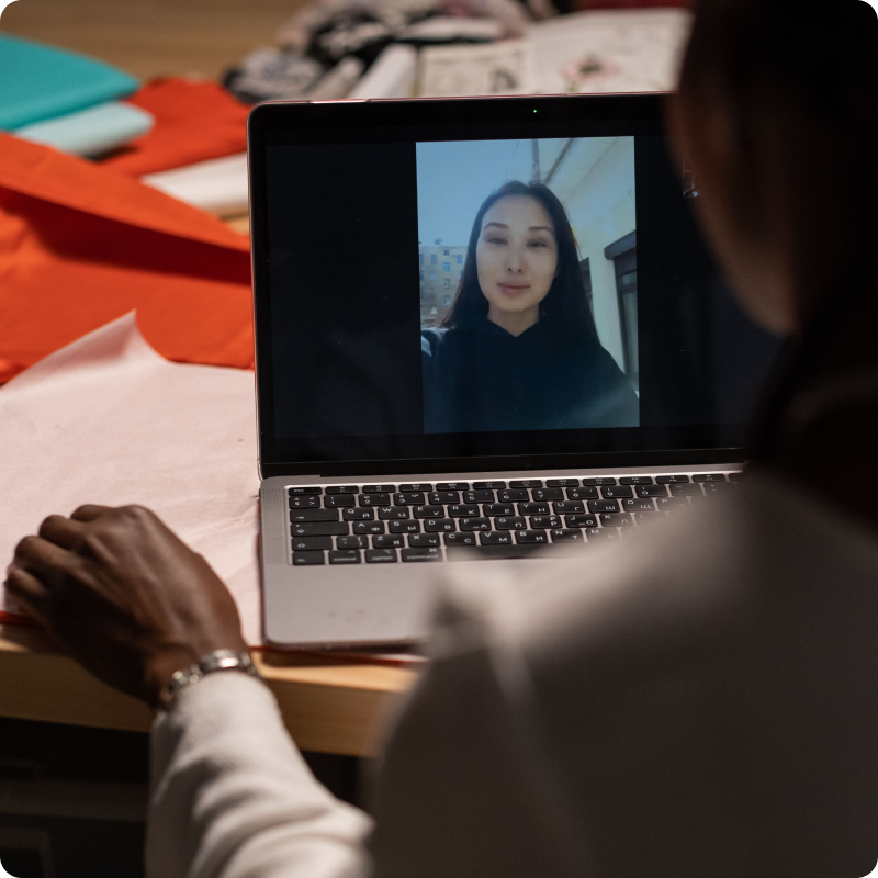 Recruiter watching a candidate video introduction on a laptop
